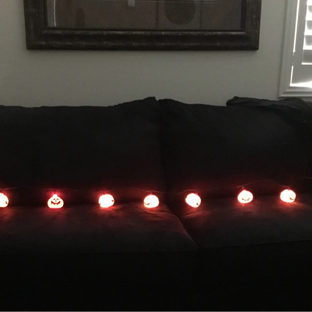 Halloween stein lights. Plastic 9’ long . 10 pumpkin lights on string.